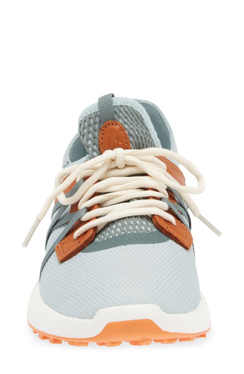 Shop Olukai Manele Golf Shoe In Pale Moss/molten Orange