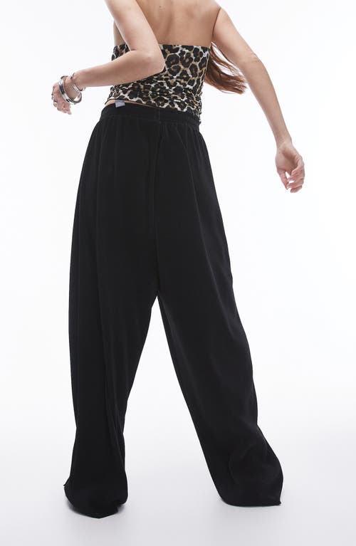 Shop Topshop Balloon Leg Plissé Pants In Black