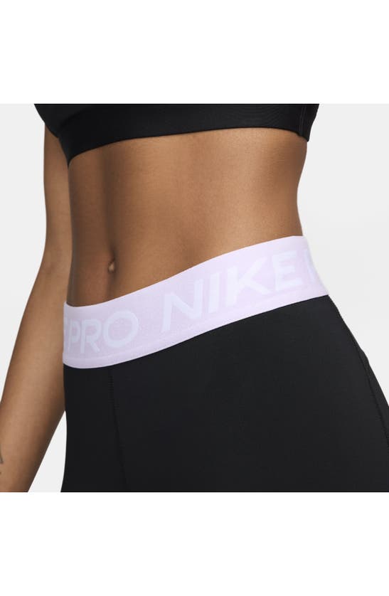 Shop Nike Pro Mid Rise Leggings In Black/ Lilac Bloom/ White