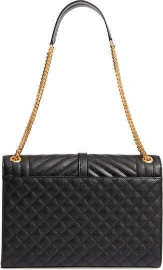 Shaped like a large envelope, SAINT LAURENT's quilted shoulder bag has been  made in Italy from durable blac…