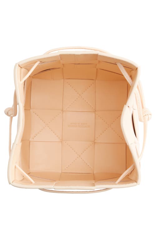 Shop Bottega Veneta Mini Cassette Drawstring Bucket Bag In Melon Washed Gold