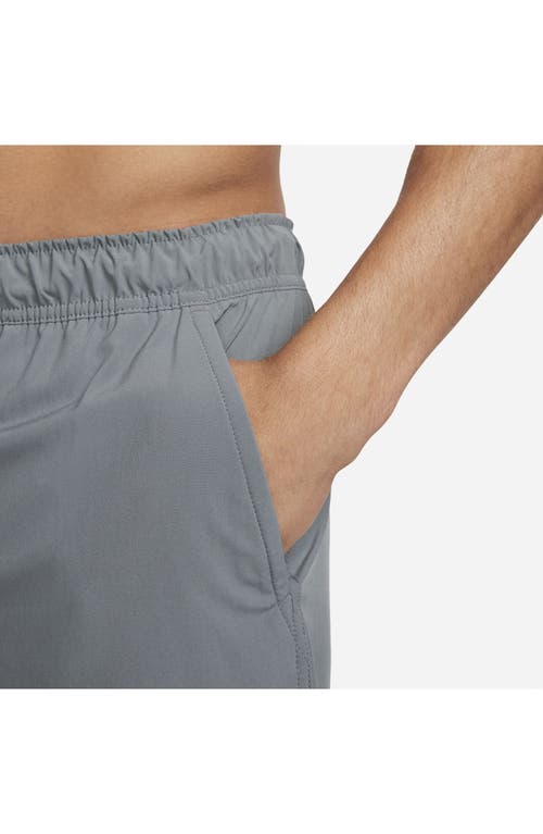 Shop Nike Dri-fit Unlimited 2-in-1 Versatile Shorts In Dark Smoke Grey/black