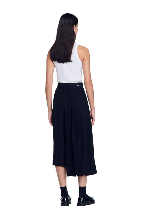 Shop Sandro Long Asymmetrical Skirt In Black