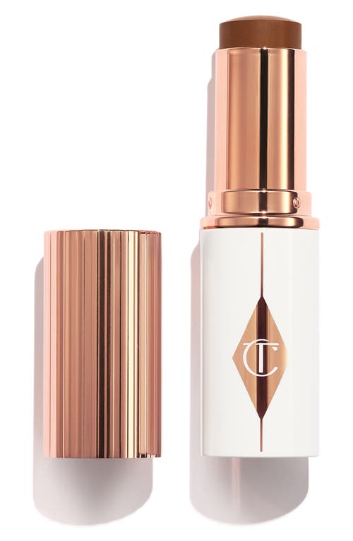 Shop Charlotte Tilbury Unreal Skin Sheer Glow Tint Hydrating Foundation Stick In 15 Deep