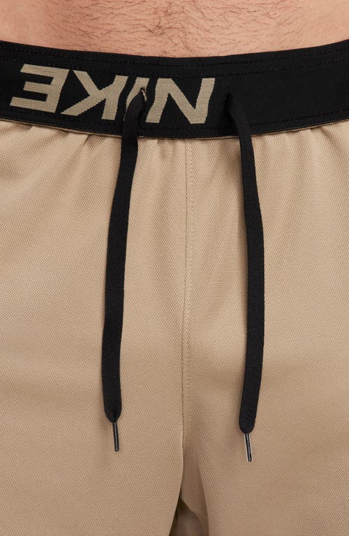 Shop Nike Dri-fit 7-inch Brief Lined Versatile Shorts In Khaki/black