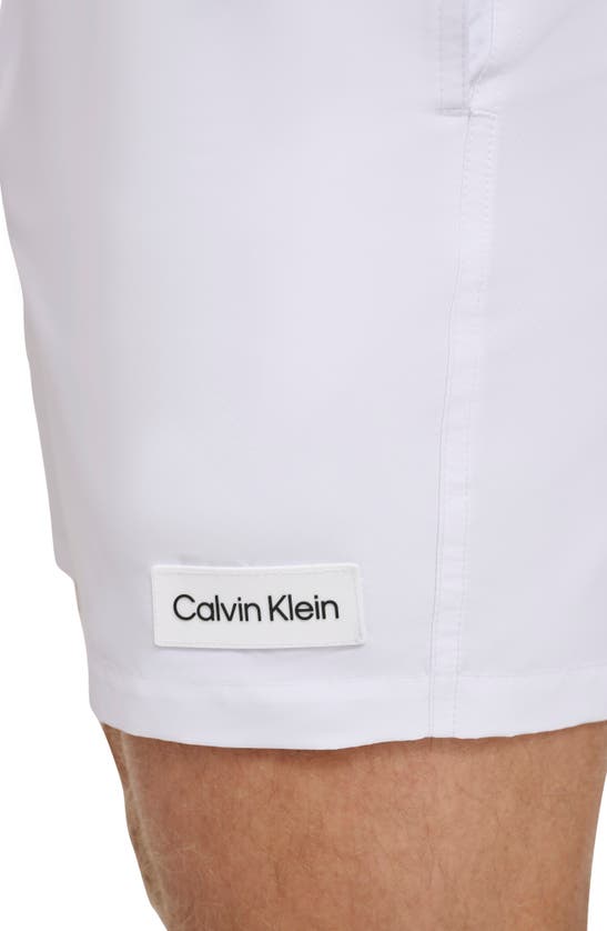 Shop Calvin Klein Modern Euro Upf 40+ Swim Trunks In White