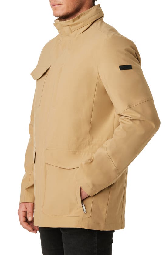 Shop Vince Camuto Water Resistant Stowaway Hood Coat In Tan