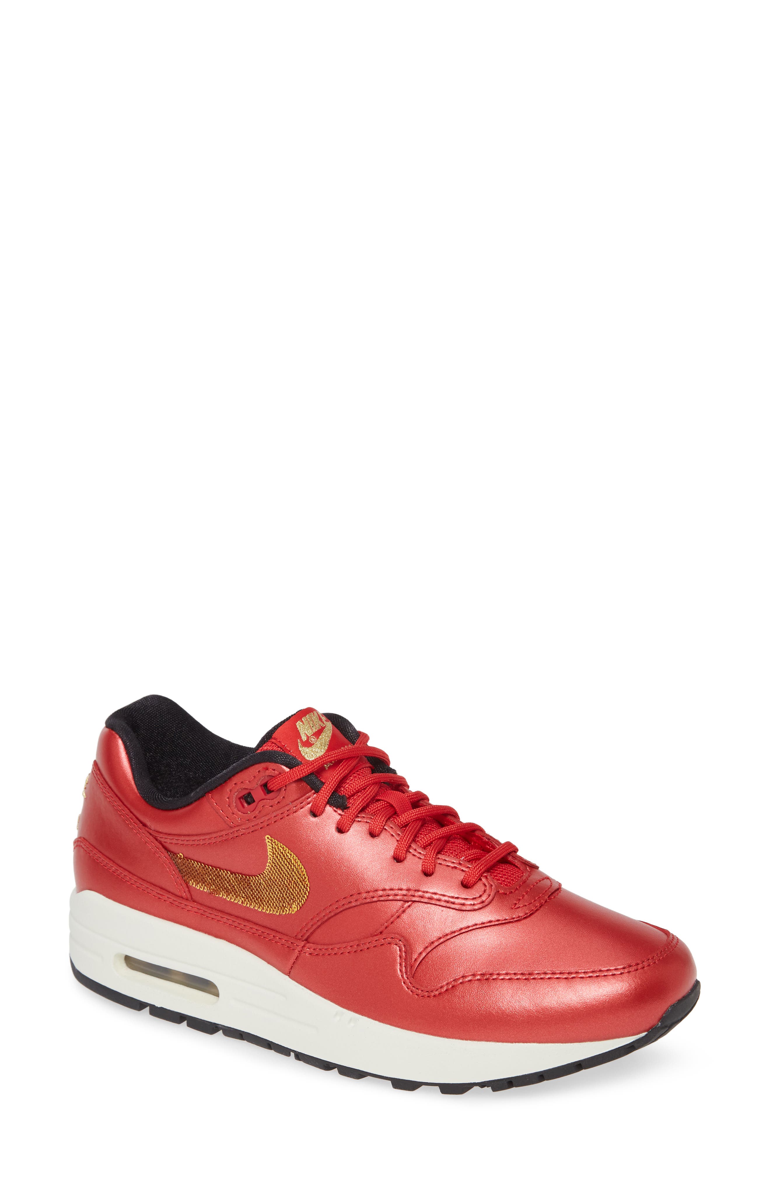 gold and red nikes