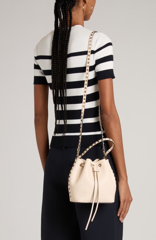 Shop Valentino Garavani Rockstud Leather Bucket Bag In Light Ivory