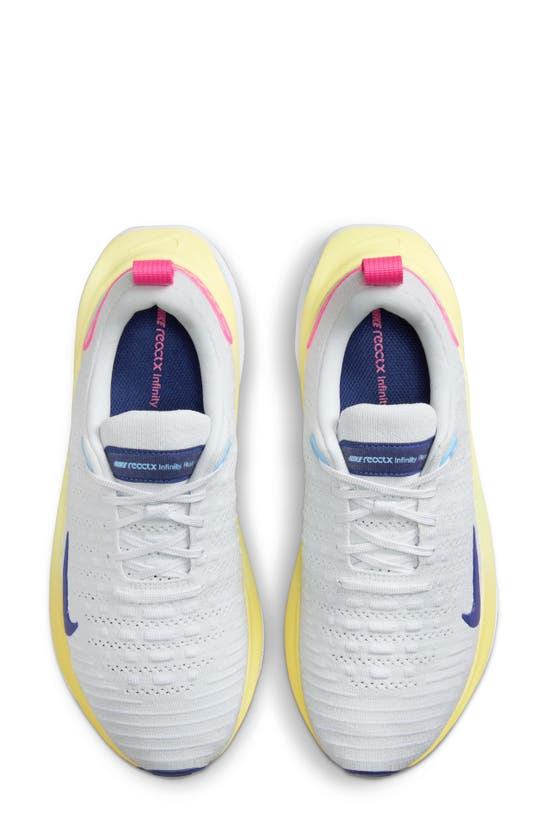 Shop Nike Infinityrn 4 Running Shoe In Photon Dust/ Blue/ White