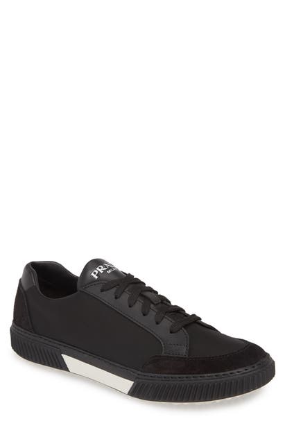 Click to view more detailed imagery on our partner's website Prada Stratus Low Top Sneaker In Nero/ Bianco