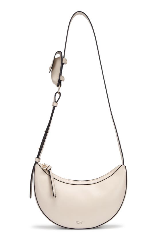 Shop Oryany Rookie Crescent Crossbody Bag In Cream