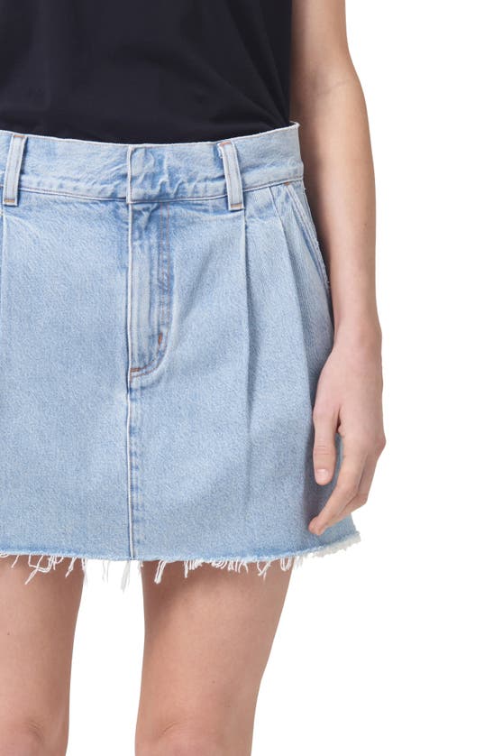 Shop Agolde Becker Raw Hem Pleated Denim Skirt In Rotate
