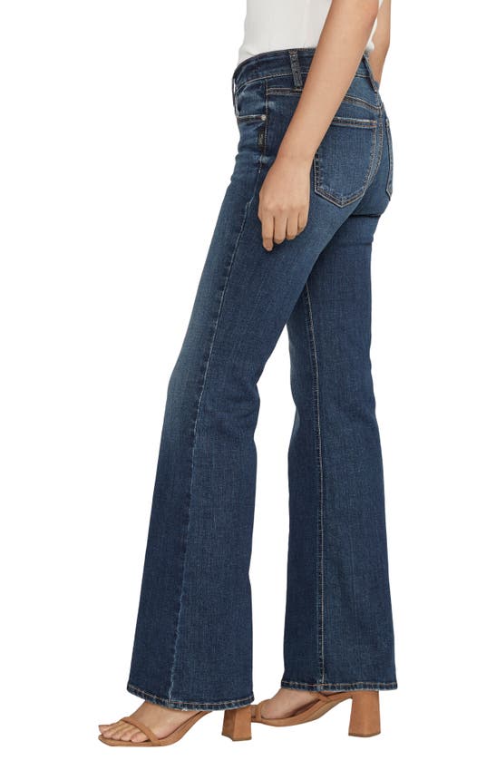 Shop Silver Jeans Co. Suki Curvy Exposed Button Mid Rise Flare Jeans In Indigo