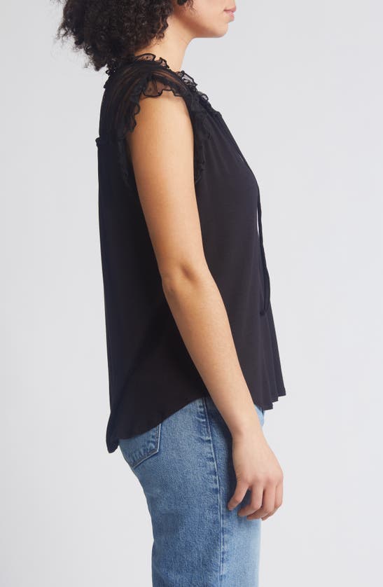 Shop Loveappella Point D'esprit Ruffle Knit Top In Black