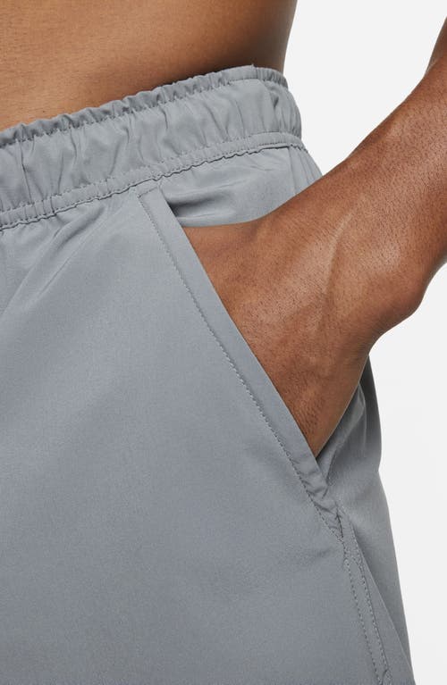 Shop Nike Dri-fit Unlimited 5-inch Athletic Shorts In Smoke Grey/black/smoke Grey