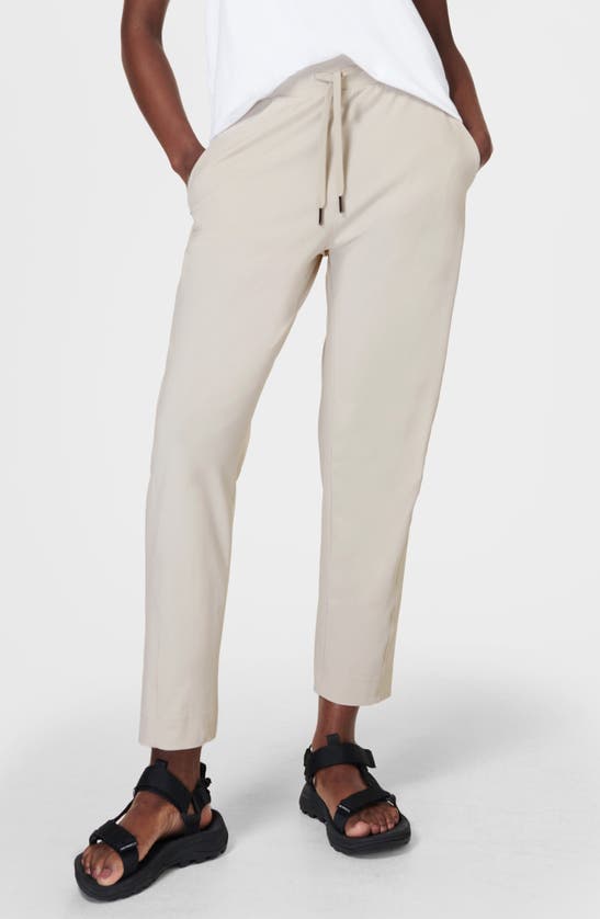 Shop Sweaty Betty Explorer Tapered Athletic Pants In Mineral Beige