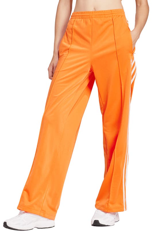 Shop Adidas Originals Firebird Track Pants In Orange