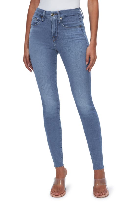 Shop Good American Good Legs Raw Hem Mid Rise Skinny Jeans In Blue655