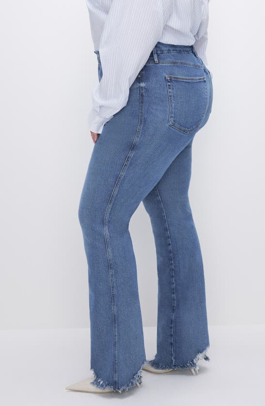 Shop Good American Good Curve Chew Hem Bootcut Jeans In Indigo631