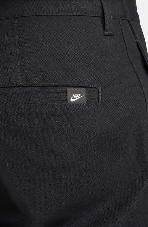 Shop Nike Club Flat Front Straight Leg Chinos In Black/black