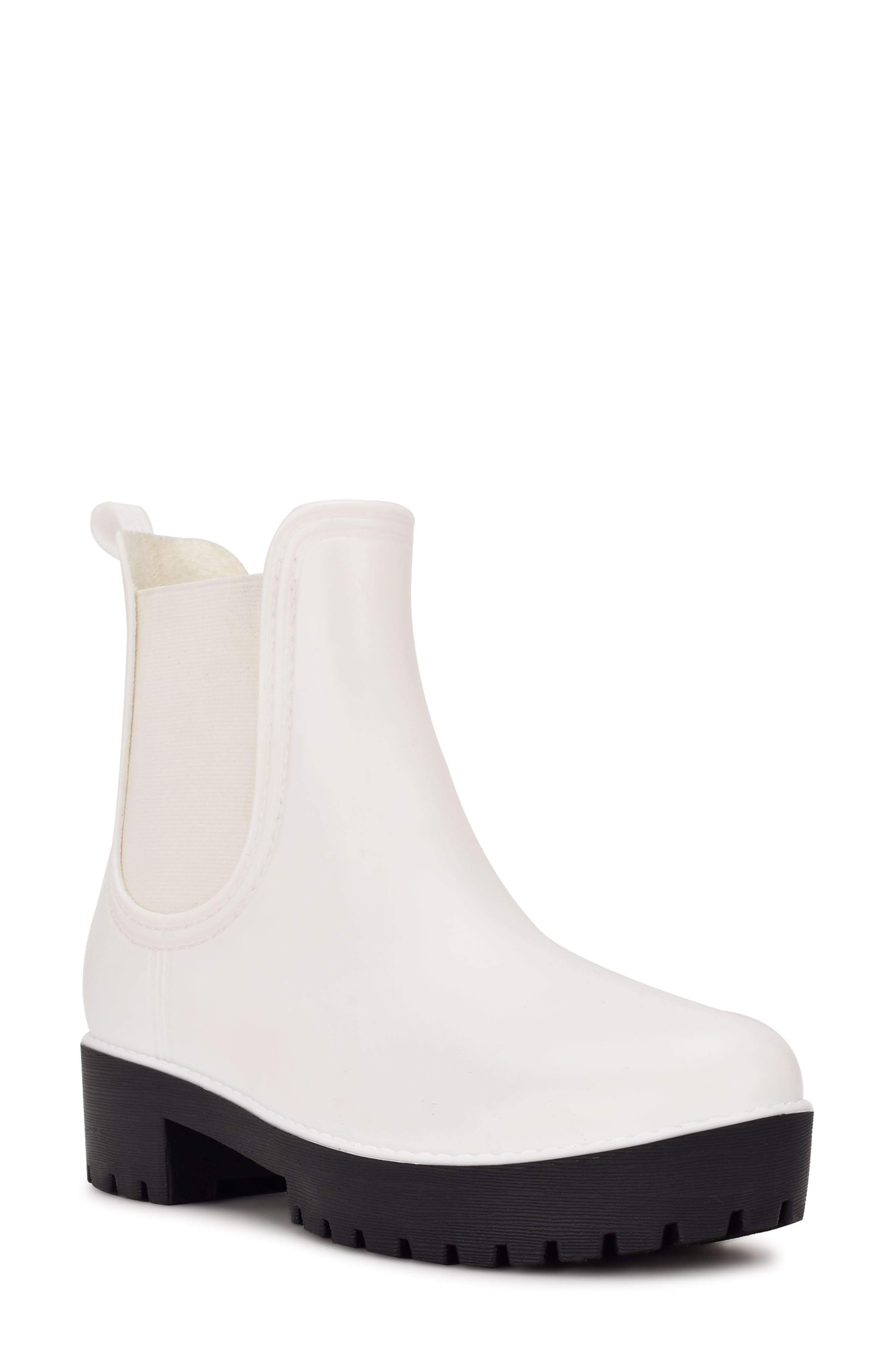 white and black rain boots