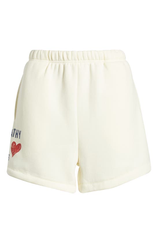 Shop The Mayfair Group Empathy Is For Lovers Graphic Sweat Shorts In Cream