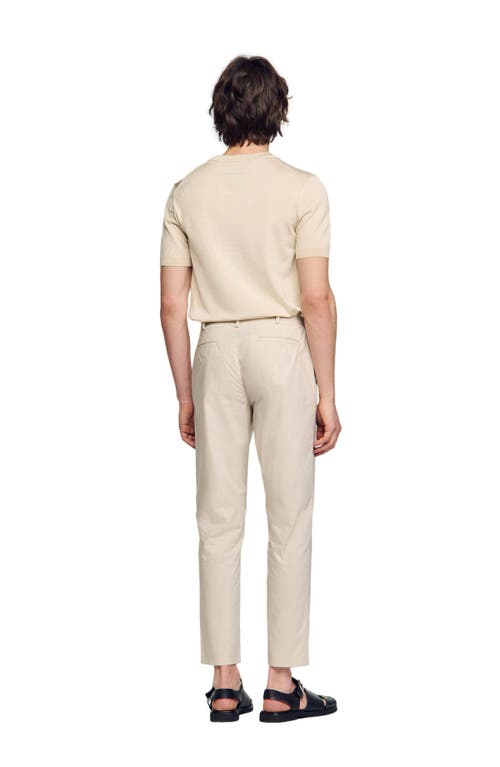 Shop Sandro Cotton Carrot-cut Trousers In Light Grey