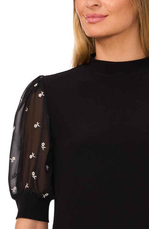 Shop Cece Mixed Media Puff Sleeve Mock Neck Top In Rich Black