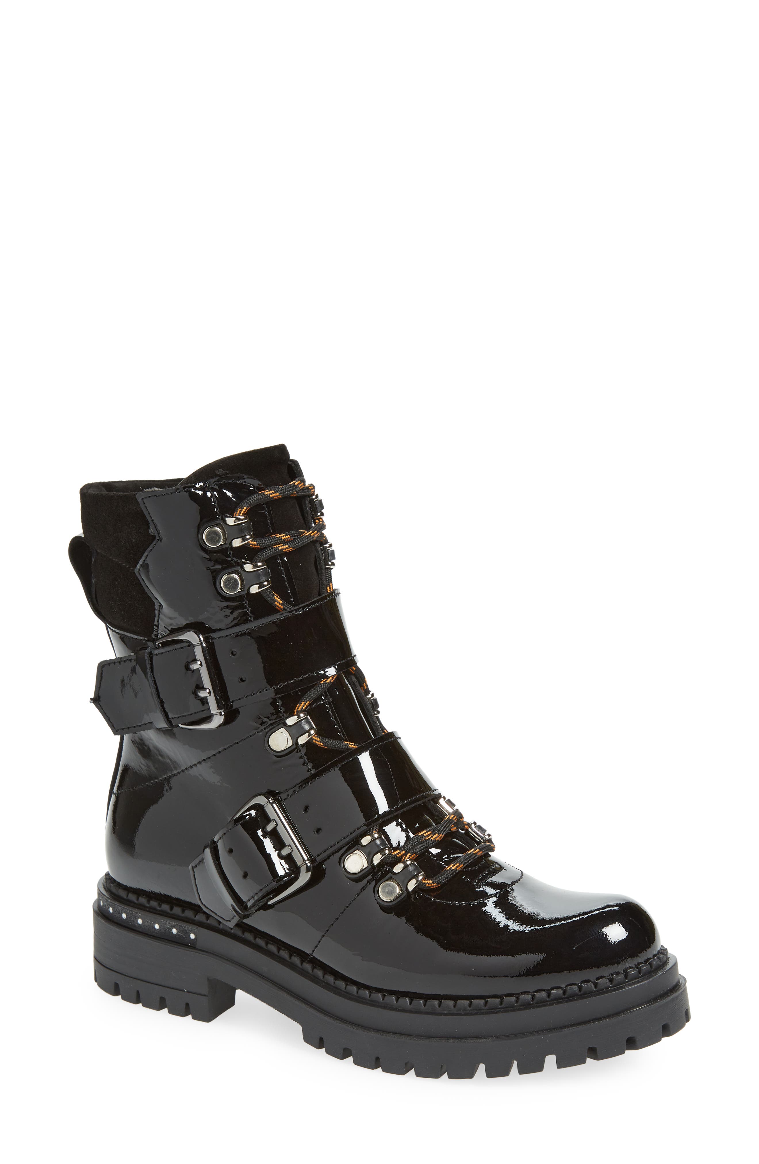 black combat boots with gold buckles