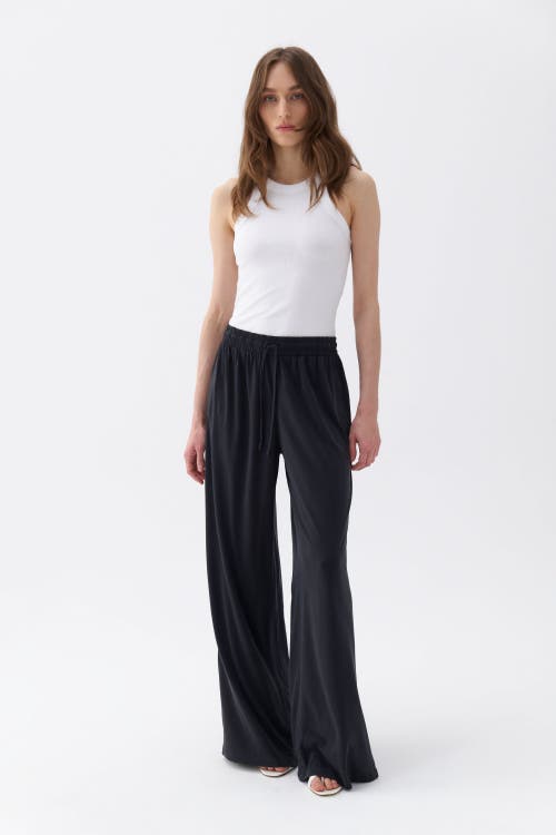 Shop Nocturne Loose Fit Wide Leg Pants In Black