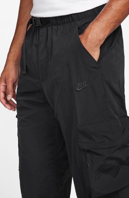 Shop Nike Tech Water Repellent Woven Cargo Pants In Black/black