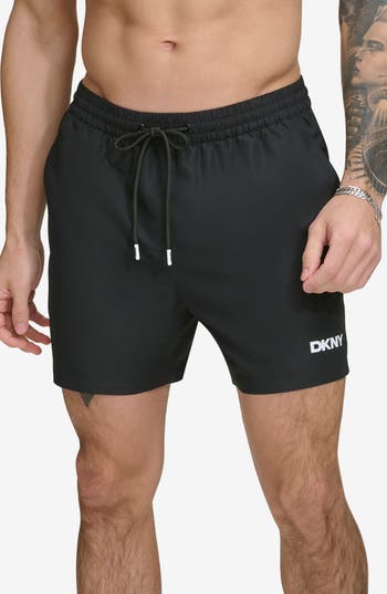 Shop Dkny Core Solid Swim Trunks In Black