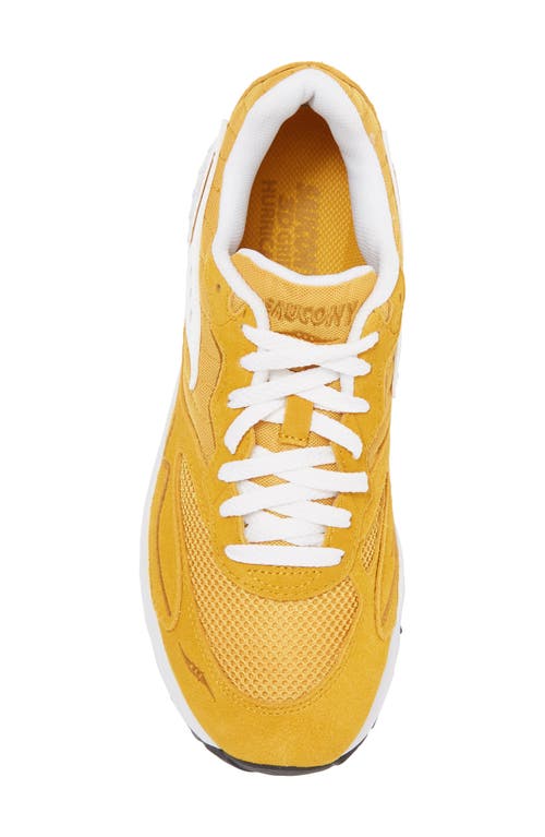 Shop Saucony 3d Grid Hurricane Sneaker In Mustard/white