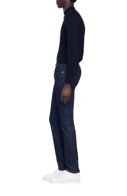 Shop Sandro Waterless Narrow Cut Jeans In Raw-denim