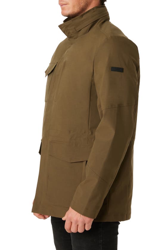 Shop Vince Camuto Water Resistant Stowaway Hood Coat In Olive