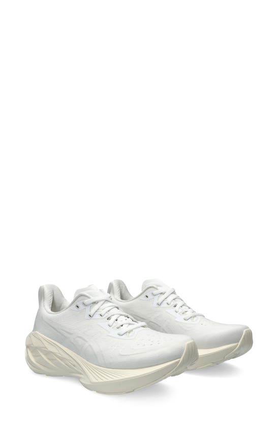 Shop Asics Novablast 4 Running Shoe In White/ White