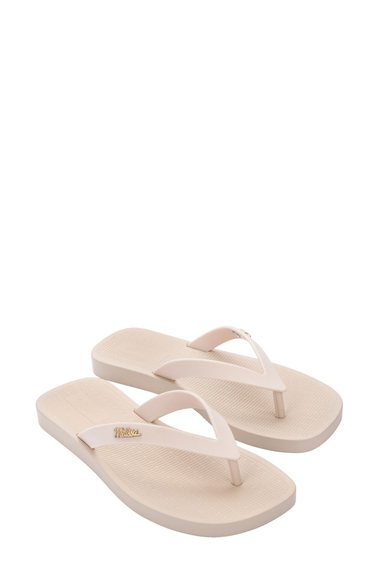 white beach flip flops