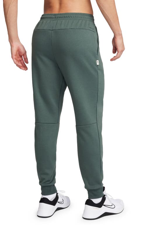 Shop Nike Primary Dri-fit Joggers In Vintage Green/vintage Green