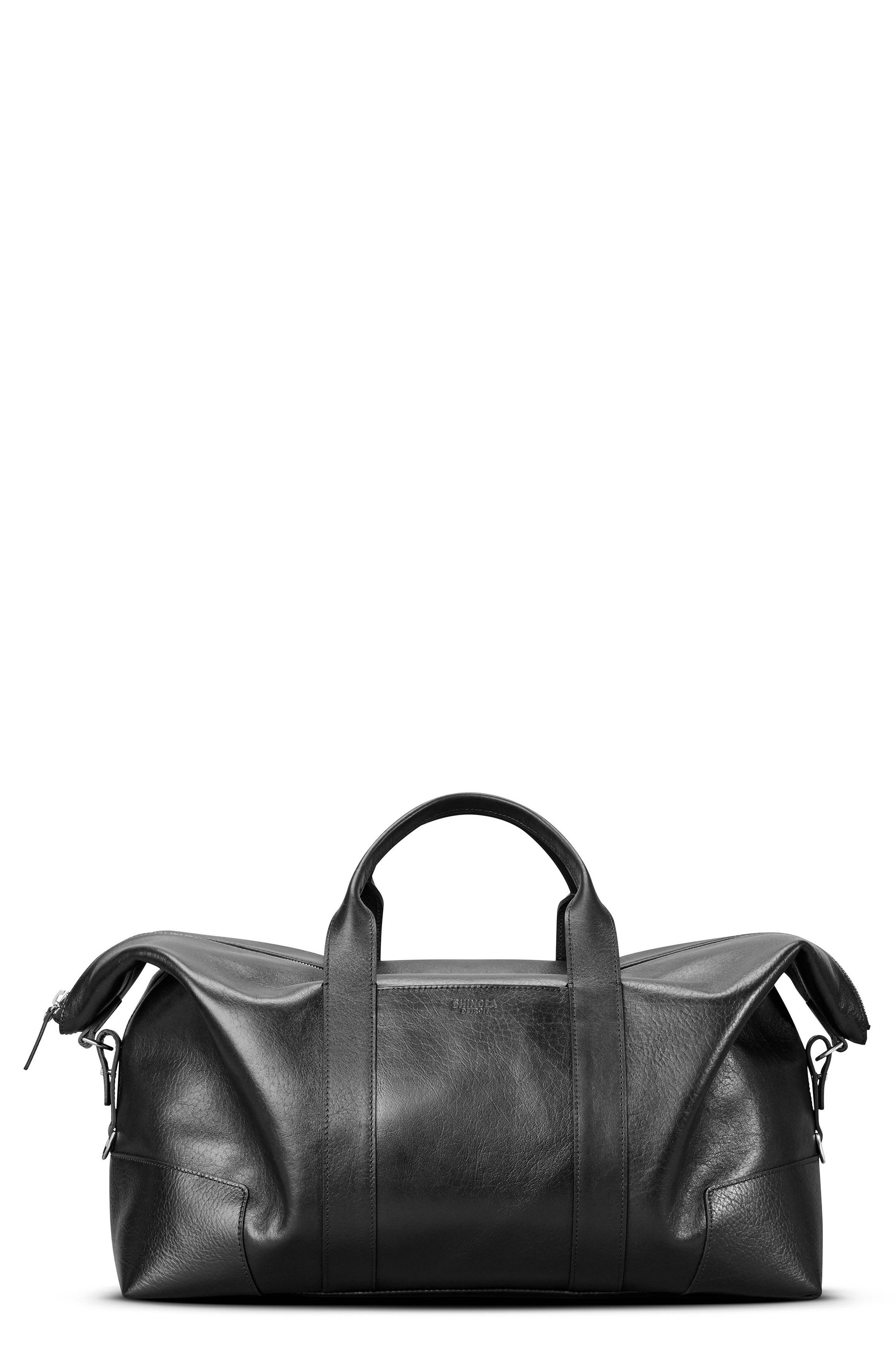 branded leather duffle bag
