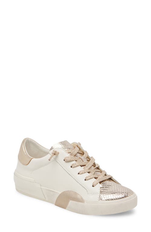 Shop Dolce Vita Zina Sneaker In White/gold Leather