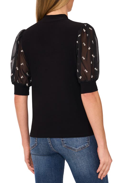 Shop Cece Mixed Media Puff Sleeve Mock Neck Top In Rich Black