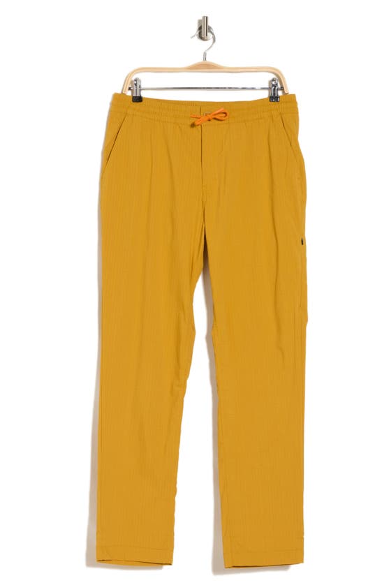 Shop Cotopaxi Salto Ripstop Pants In Amber