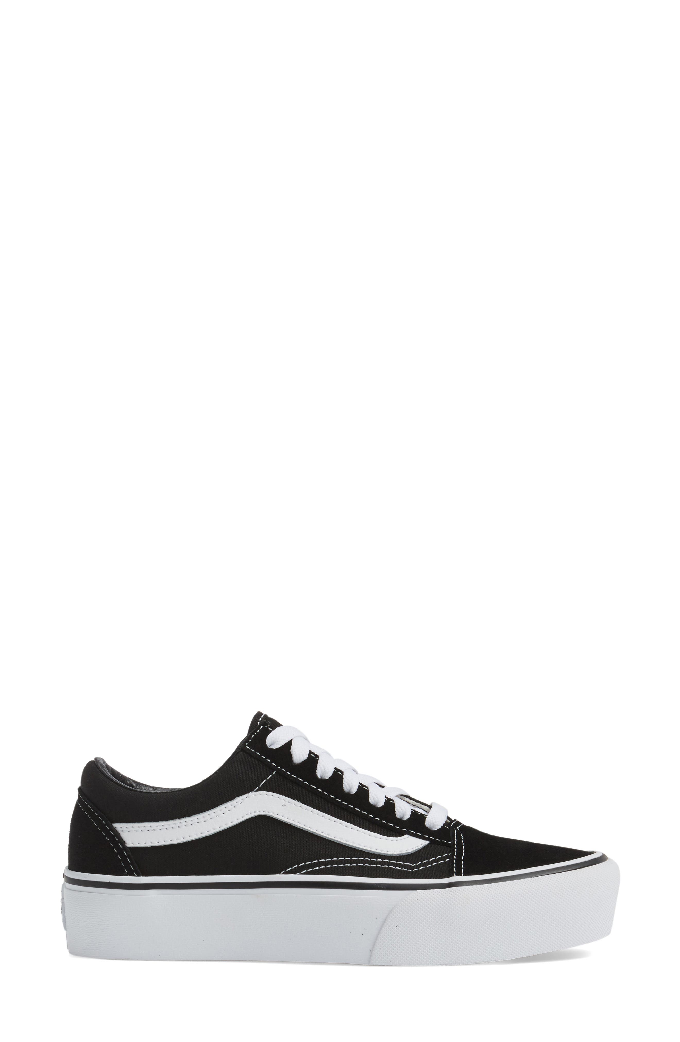 white and black low top vans