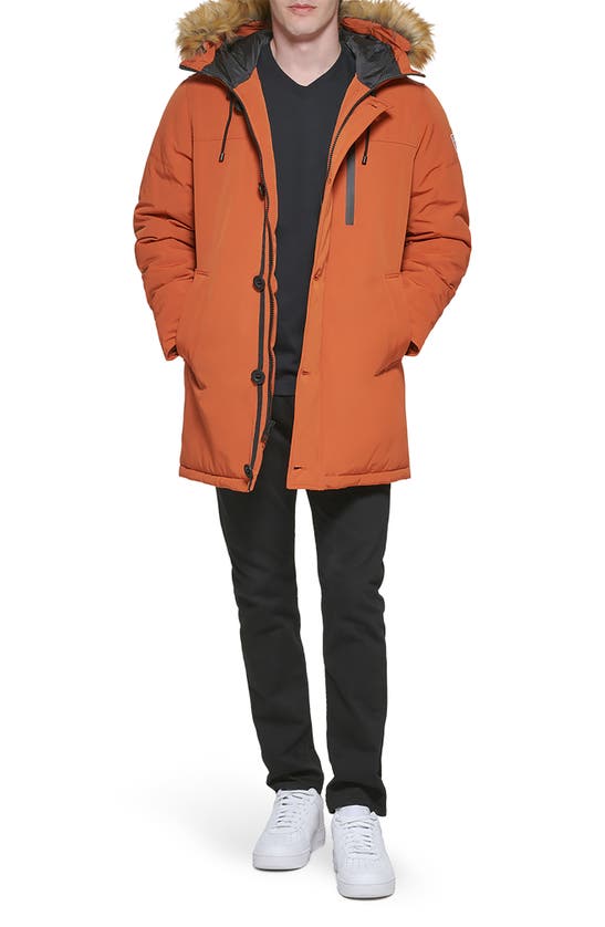Guess Faux Fur Trim Hooded Parka Jacket In Rust