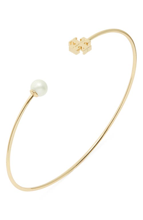 Shop Tory Burch Kira Imitation Pearl Cuff Bracelet In Tory Gold/ivory Pearl