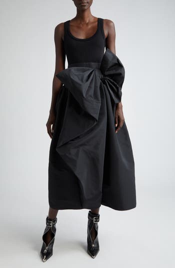 Versace - Stella Maxwell wears a black silk evening dress enriched