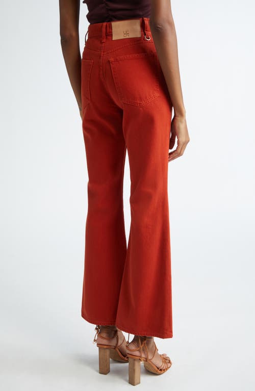 Shop Ulla Johnson The Lou Button Fly Flare Jeans In Red Ochre Wash