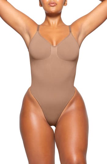 Skims Seamless Sculpt Low Back Thong Bodysuit in Brown