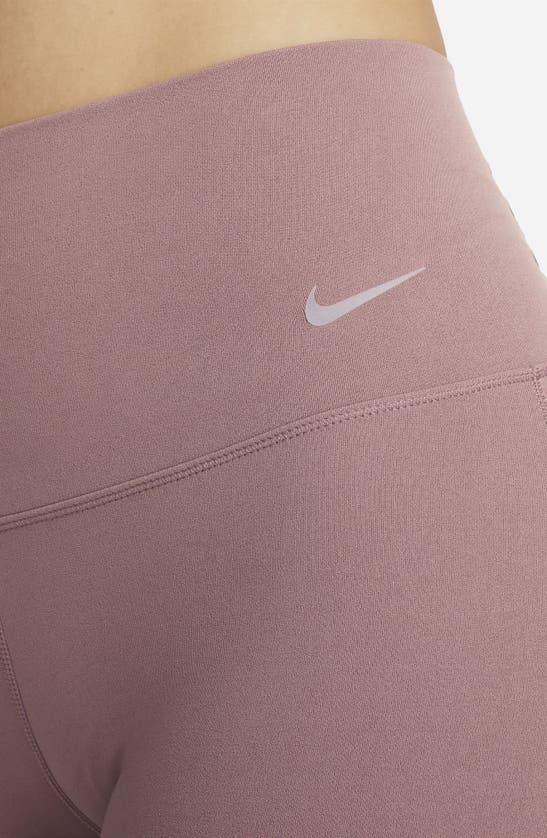 Shop Nike Dri-fit Flare Leggings In Smokey Mauve